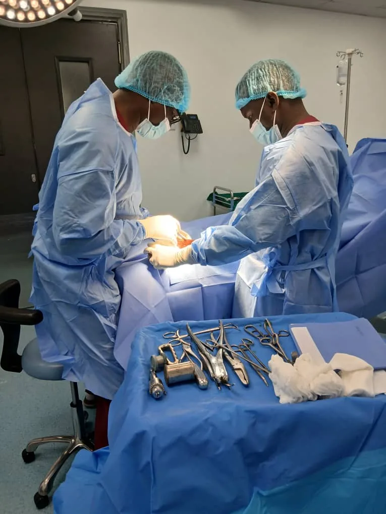 Orthopaedic surgical team working together during a clinical procedure